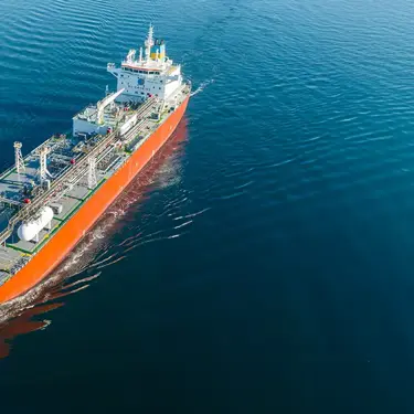 Cargo vessel sailing across open water.